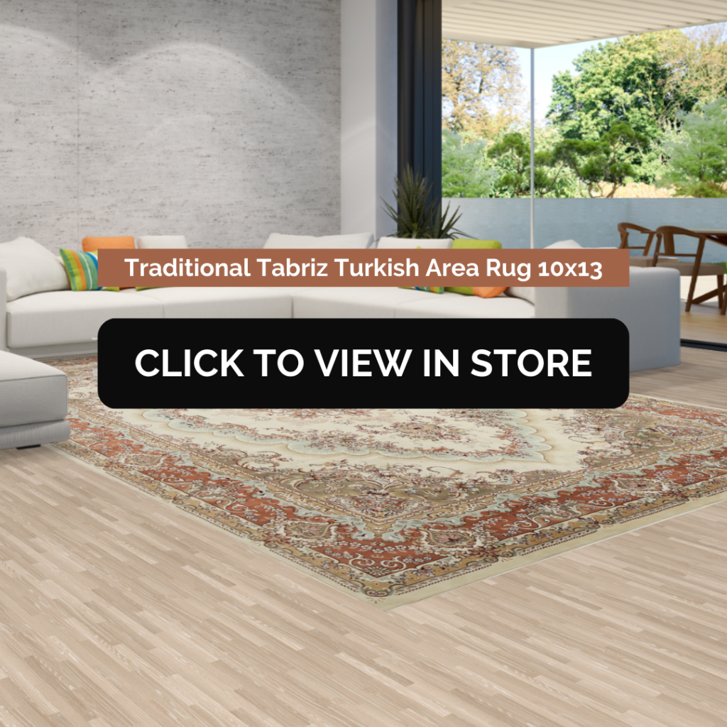 Modern living room showcasing a 10x13 Traditional Tabriz Turkish area rug with intricate patterns in warm red, beige, and cream tones, placed under a coffee table on light wood flooring. Large windows reveal a serene outdoor setting with lush greenery.