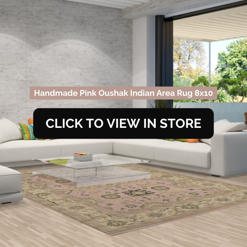 Modern living room showcasing a handmade pink Oushak Indian area rug measuring 8x10, featuring intricate patterns, placed under a glass coffee table surrounded by a sleek white sectional sofa with colorful cushions, complemented by a large window with scenic views.