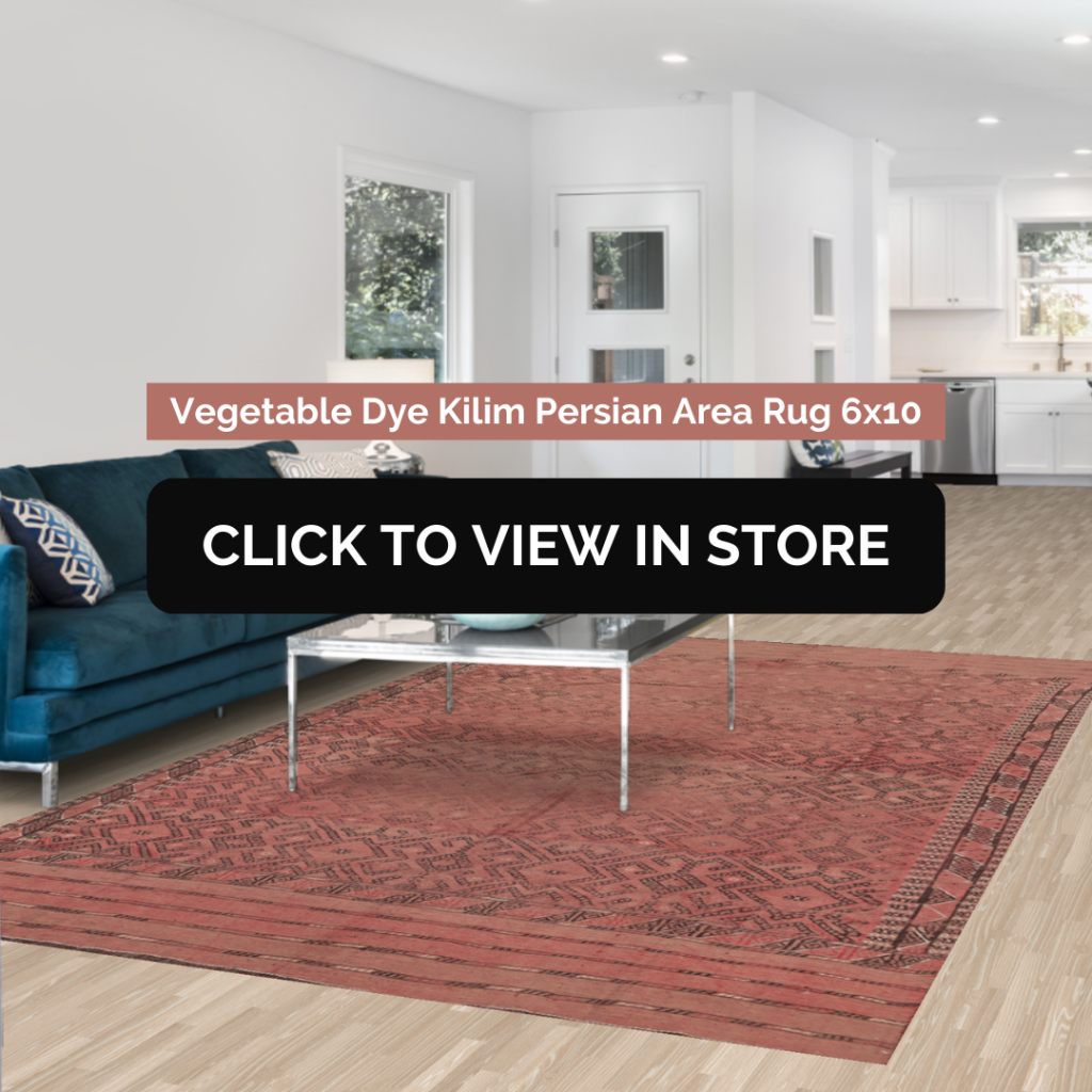 Contemporary living space featuring a 6x10 vegetable-dyed Kilim Persian area rug in rich red tones with intricate patterns, placed under a sleek glass coffee table, accompanied by a plush blue sofa with decorative cushions, in a bright open-plan setting with large windows.