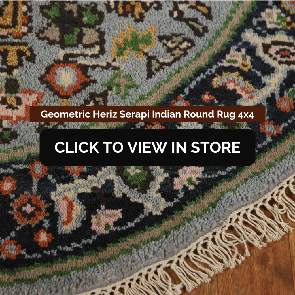 Geometric Heriz Serapi Indian Round Rug (4x4) showcasing a close-up view of intricate patterns with floral and geometric motifs in shades of gray, green, orange, and black. The rug has a decorative fringe, adding to its traditional appeal. The image includes text: "Geometric Heriz Serapi Indian Round Rug 4x4" and a call-to-action button: "CLICK TO VIEW IN STORE."