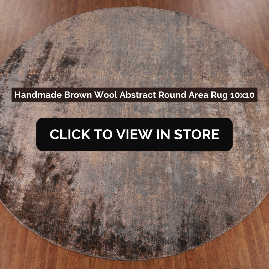 Handmade Brown Wool Abstract Round Area Rug (10x10) placed on a wooden floor. The rug features a distressed, abstract pattern in shades of brown and gray, giving it a vintage yet modern aesthetic. The image includes text: "Handmade Brown Wool Abstract Round Area Rug 10x10" and a call-to-action button: "CLICK TO VIEW IN STORE."