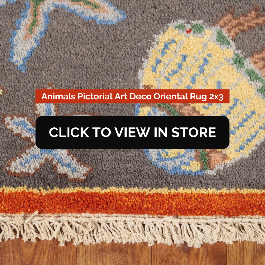 A Animals Pictorial Art Deco Oriental Rug (2x3) displaying a close-up of a finely woven design featuring colorful elements, possibly depicting birds and floral patterns on a gray background. The rug has a rich orange and red fringe, with fine details in blue, yellow, and brown hues. The image contains text: "Animals Pictorial Art Deco Oriental Rug 2x3" and a call-to-action button: "CLICK TO VIEW IN STORE."