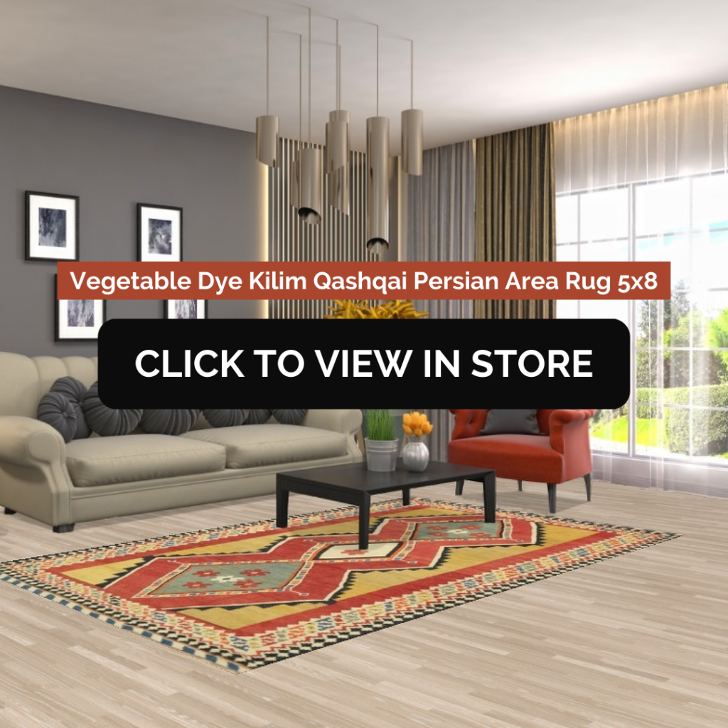 A modern living room showcasing a Vegetable Dye Kilim Qashqai Persian Area Rug (5x8) with a geometric tribal pattern in red, gold, and beige. The space includes a neutral-toned sofa, a black coffee table, a red accent chair, pendant lighting, and framed wall art. The image contains text: "Vegetable Dye Kilim Qashqai Persian Area Rug 5x8" and a call-to-action button: "CLICK TO VIEW IN STORE."