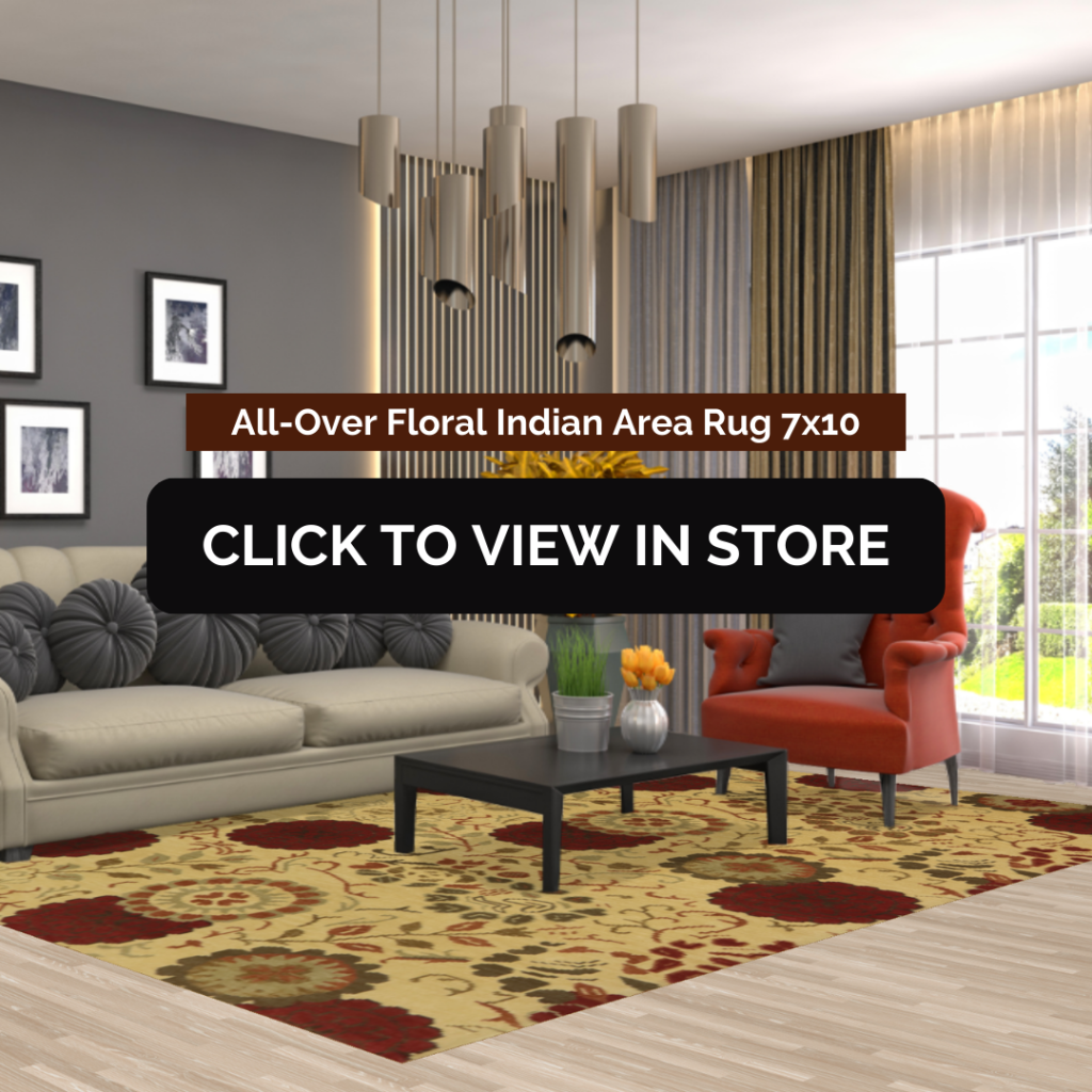 A modern living room showcasing an All-Over Floral Indian Area Rug (7x10) with a beige background and large red and brown floral motifs. The room features a beige sofa with decorative pillows, a black coffee table, a red accent chair, and a contemporary chandelier hanging from the ceiling. The image includes text: "All-Over Floral Indian Area Rug 7x10" and a call-to-action button: "CLICK TO VIEW IN STORE."