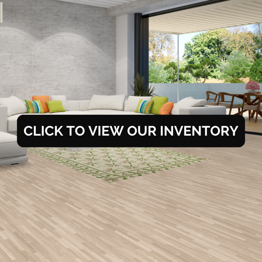 A minimalist modern living room with a soft floral-patterned Kilim Durrie rug in light green and pink tones. The rug adds a touch of elegance to the neutral space, harmonizing with the sleek white furniture.
