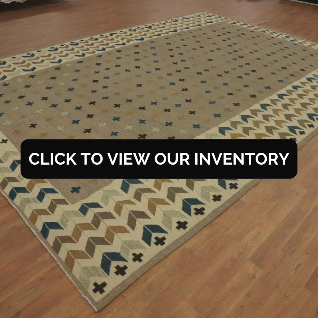Brown Wool Kilim Oriental Area Rug 10x13
A brown wool kilim rug with colorful geometric borders is displayed in a showroom with a polished wooden floor. The rug features a playful yet earthy palette of blues, tans, and creams.