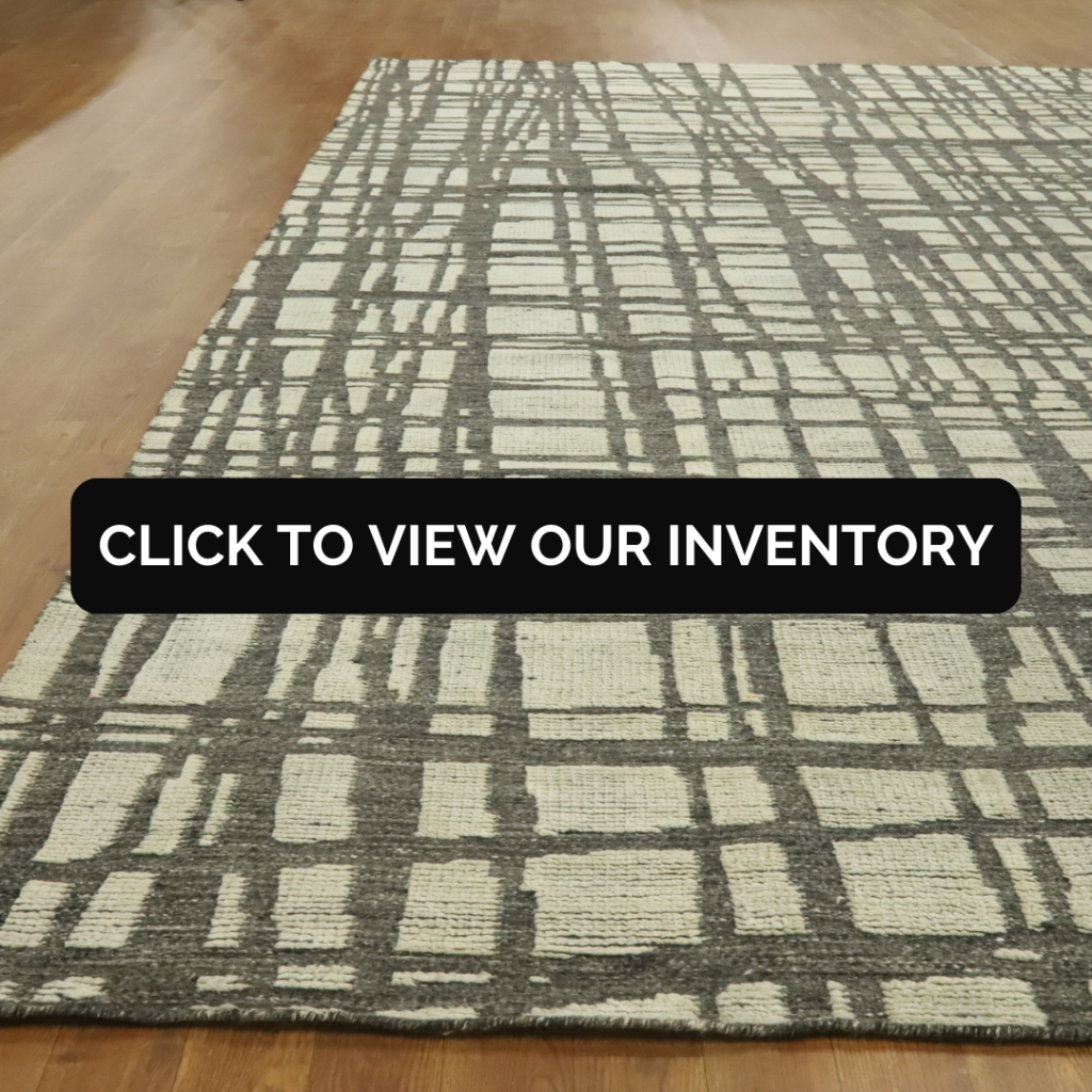 Modern Wool Abstract Indian Area Rug 9x12
This Indian area rug features an abstract linear pattern in charcoal and cream tones on a wooden floor. The contemporary design offers a bold, graphic element for modern interiors.