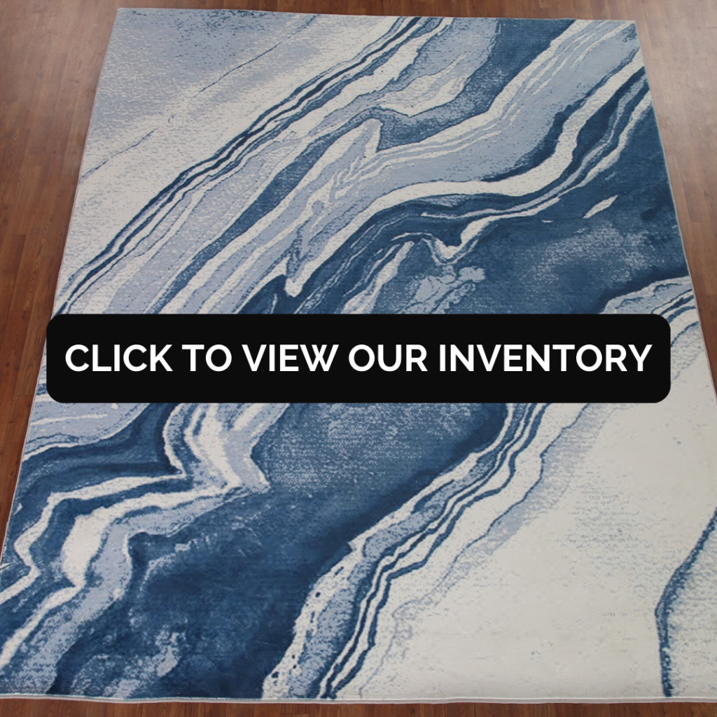 Contemporary Blue Rug
A modern area rug in shades of blue and white with a fluid, marble-like pattern covers a hardwood floor. The design gives a contemporary and artistic touch to the space, perfect for a bold interior style.