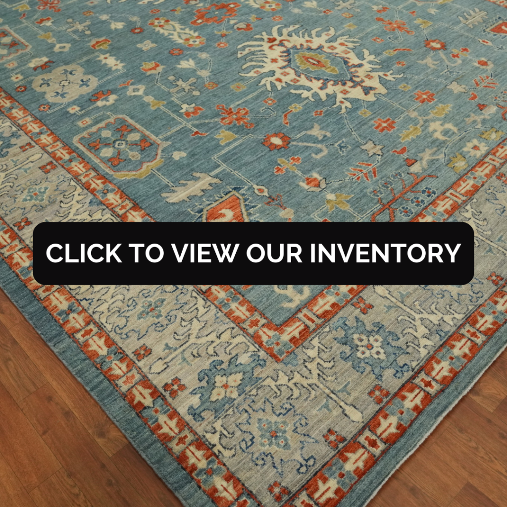Vegetable Dye Wool Oushak Turkish Area Rug 9x12
This Turkish Oushak rug features a sky blue base with bright orange and ivory floral patterns, bordered by intricate geometric details. It is displayed on a polished wooden floor in a showroom.