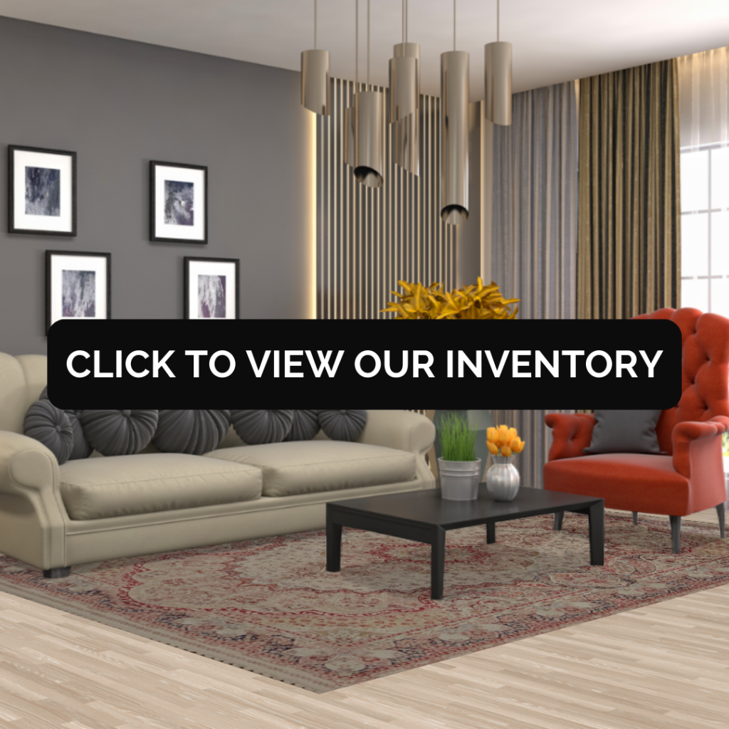 A contemporary living room with a beige sofa and red armchair, showcasing a traditional red and beige rug under a black banner with the text “Click to View Our Inventory.”