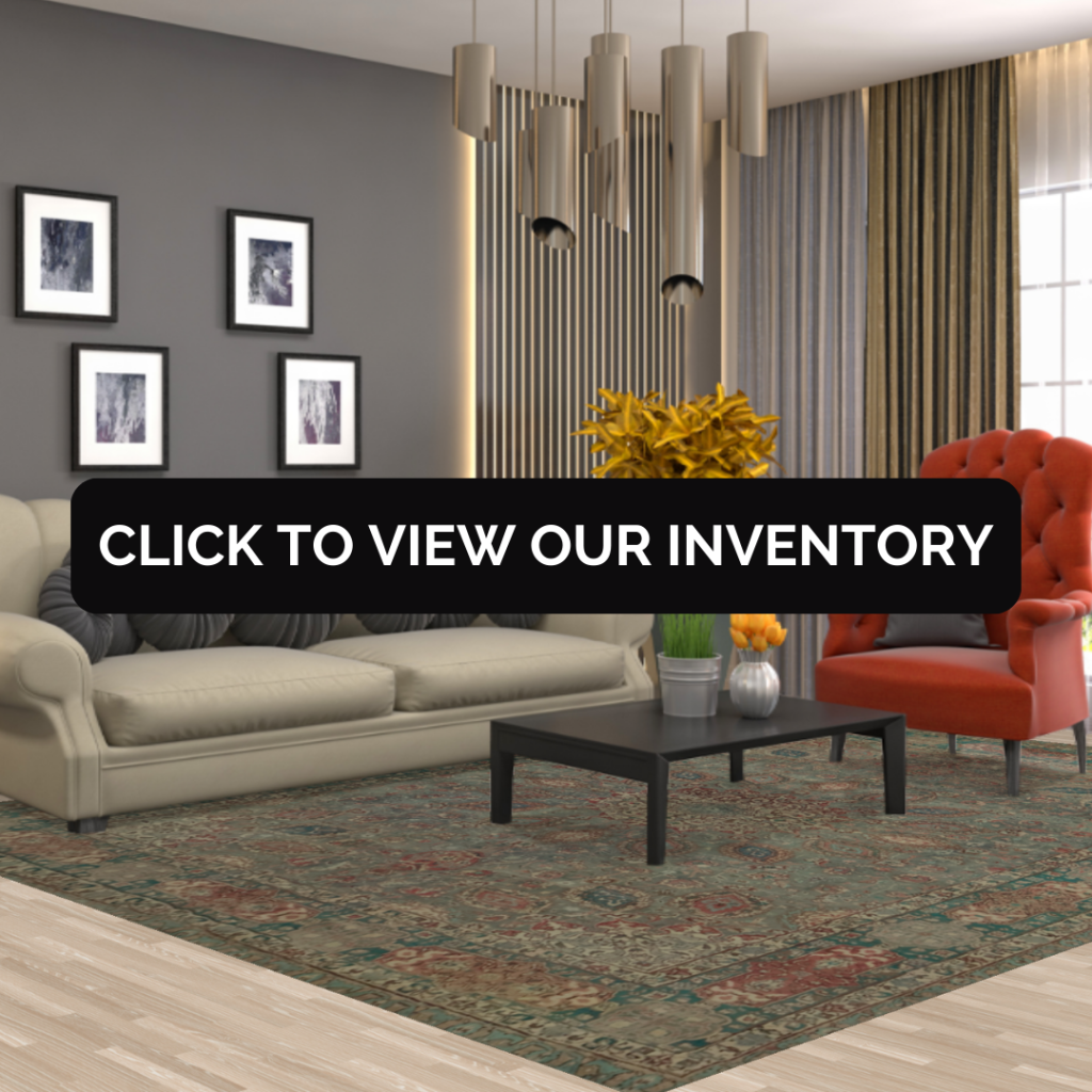 A bright open-concept living room with a teal sofa and glass coffee table, highlighting a dark green patterned rug beneath a black banner labeled “Click to View Our Inventory.”