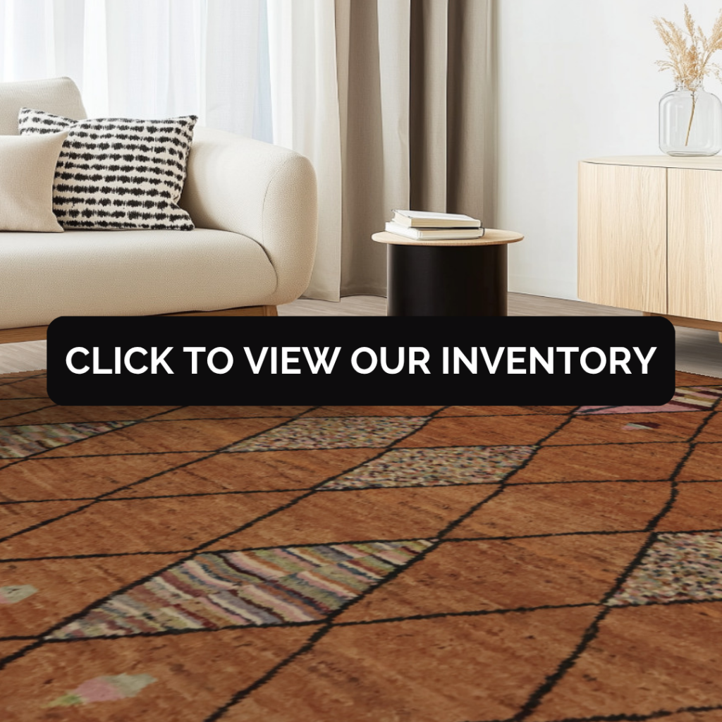 A contemporary room with neutral furniture and minimalist décor. The rug is warm brown with black crisscross lines, featuring subtle diamond-shaped accents. Text overlay reads “Click to view our inventory.”