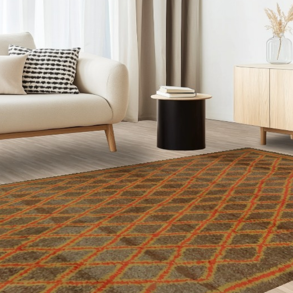 A light, airy living room with a cream sofa and geometric diamond-pattern rug in muted green and orange tones. A black round side table and light wood console create a calm, modern look.