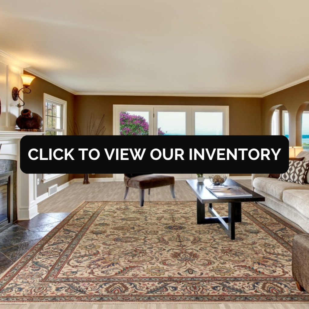 A classic living room with warm brown walls and a beige sofa, centered around a large cream and taupe floral rug. The room features a black coffee table, fireplace, and bright natural light.