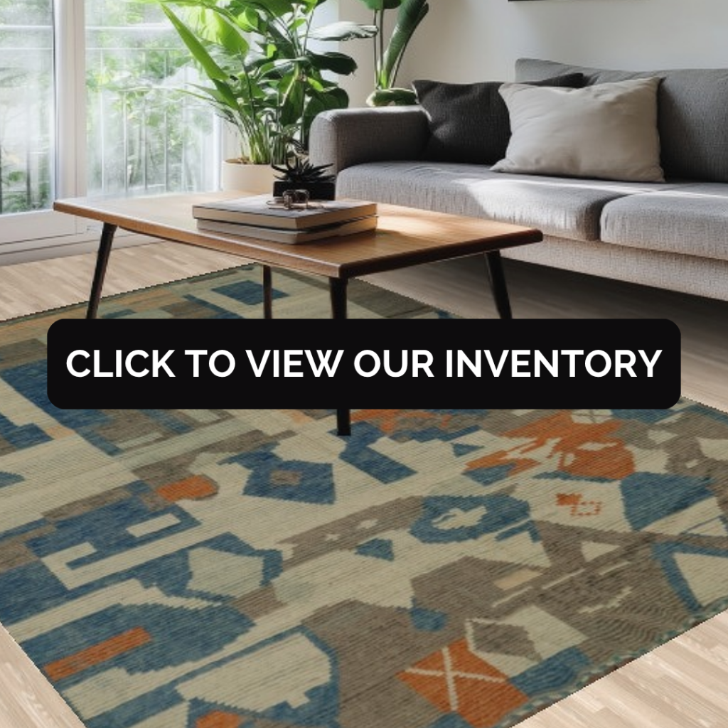 A cozy living area with a wooden coffee table, gray sofa, and a bold geometric rug featuring blue, orange, and taupe shapes. The design is modern and vibrant.
