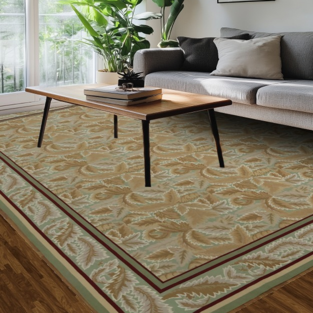 A close-up view of a vintage-style rug with rich red tones and intricate green and beige floral detailing, showing worn texture and classic design. A black banner overlays the center with the text “Click to view our inventory.”