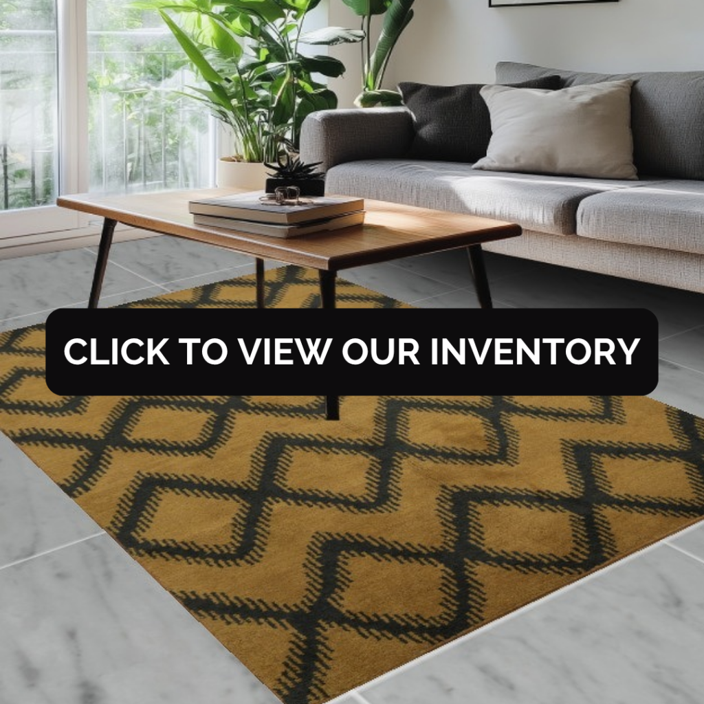 A bright living room with a gray sofa, wooden coffee table, and indoor plants, styled over a mustard-yellow geometric rug. A bold black banner in the center says “Click to view our inventory.”